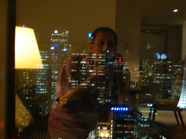 The real and the virtual in one pic...I was clicking Sydney lights from inside my hotel room