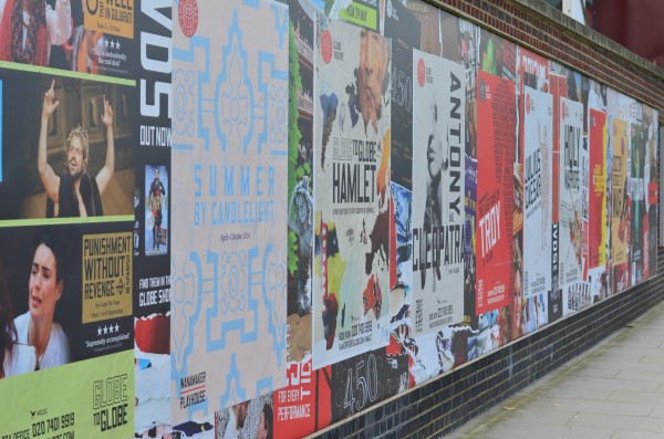 Wall posters in front of the Globe theatre...