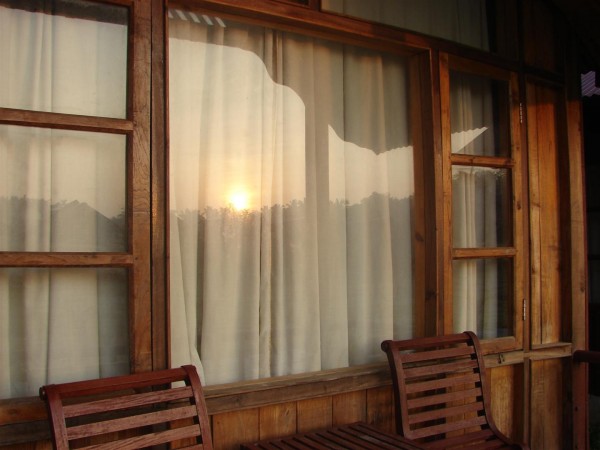 The morning sun reflected on the glass pane of our cottage on Havelock