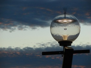 The evening sky of Sydney reflected in a lamp-post near the Opera House.