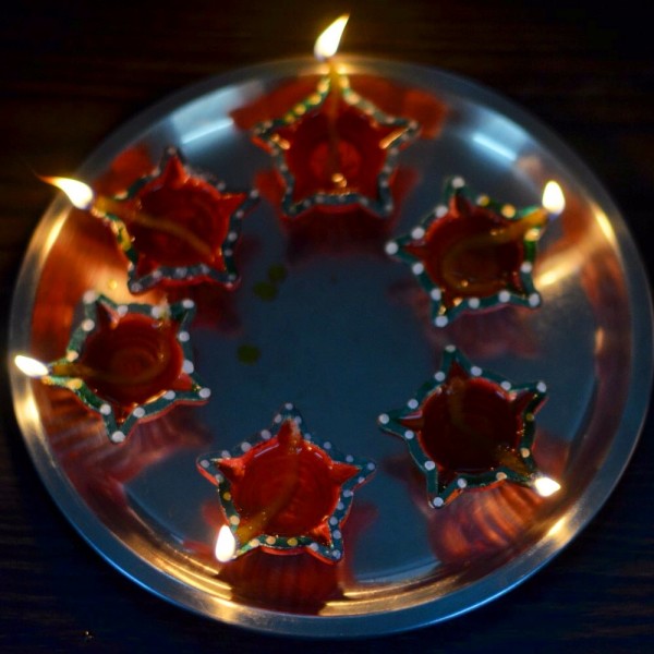 My Diwali 2014 photo-essay. Lighted diyas are first offered to the Gods and then kept all over the house.