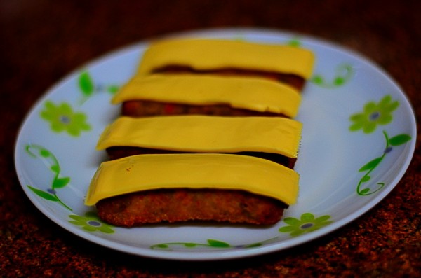 Cheese-smeared veggie fingers... the technique is to first fry the McCain veggie-fingers and only then place a longitudinally cut cheese slice on it before micro-waving it for 30 seconds. 