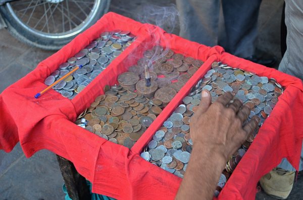 Vendors on the streets of Delhi - the old coins seller